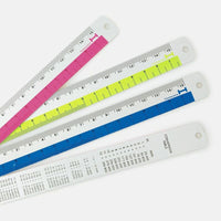 Four colorful rulers with millimeter markings on a white background